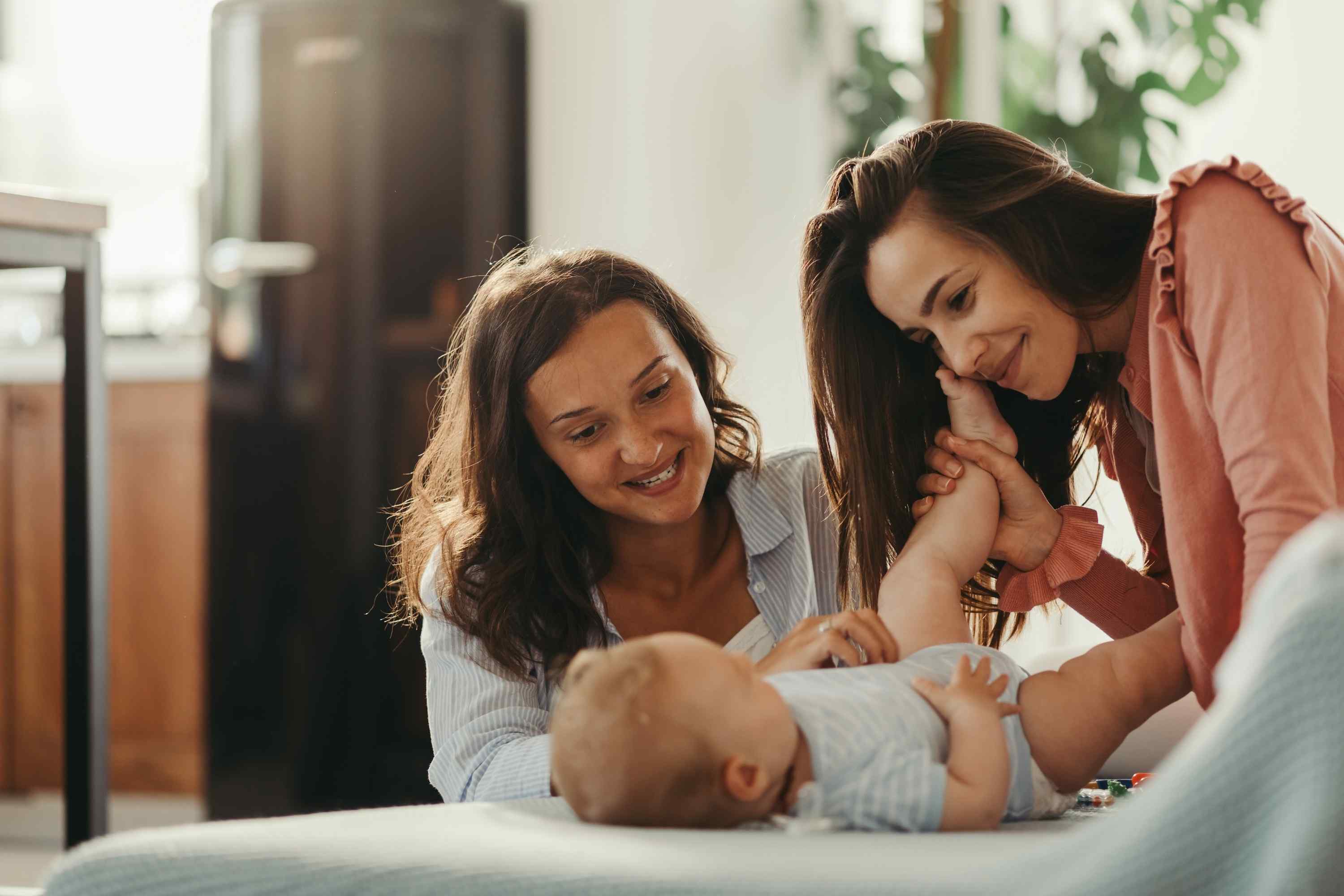 Women smiling at baby